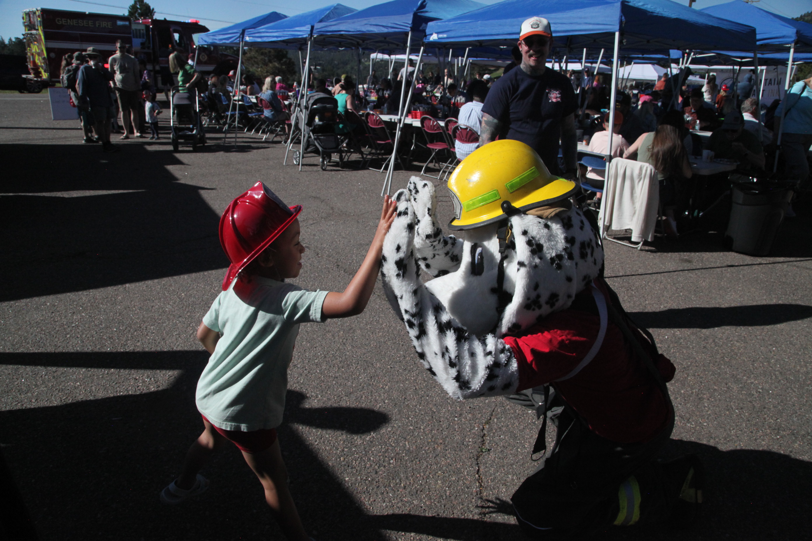 Sparky & Kid High-Fiving at Pancake Breakfast